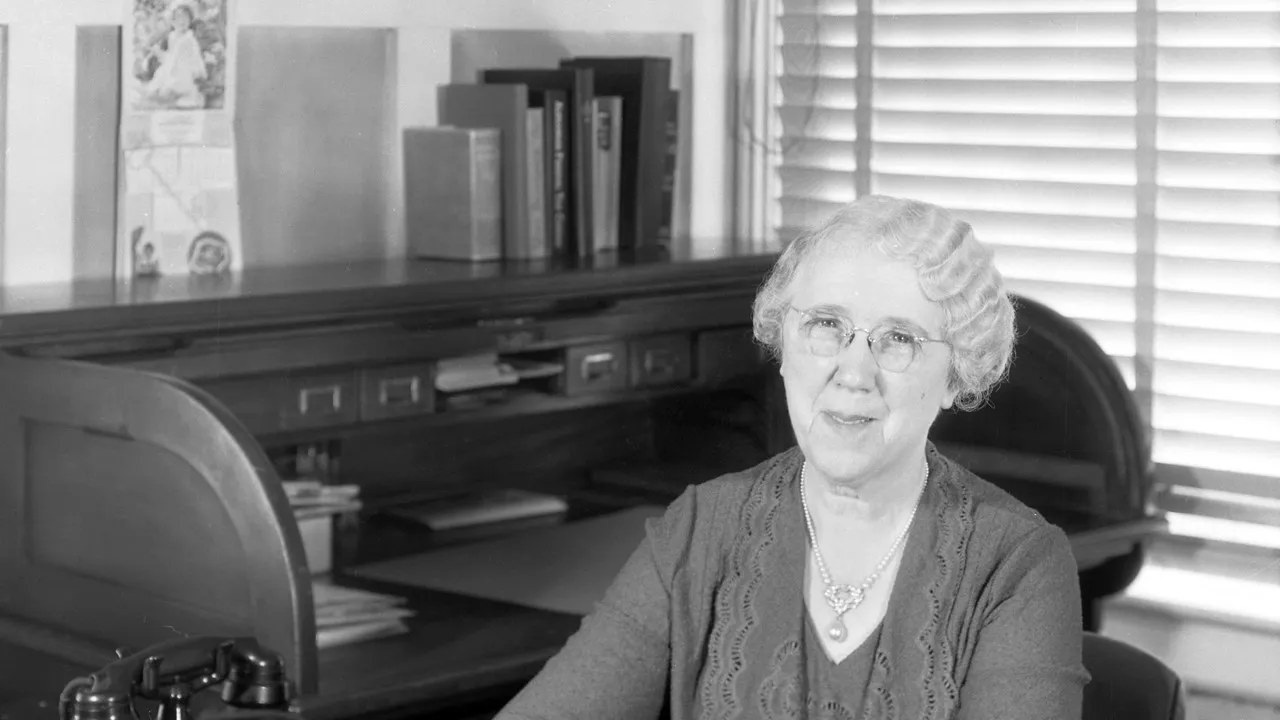 Tillie Thorkelson in 1932, seated at a roll-top desk in her office at S.C. Johnson & Son